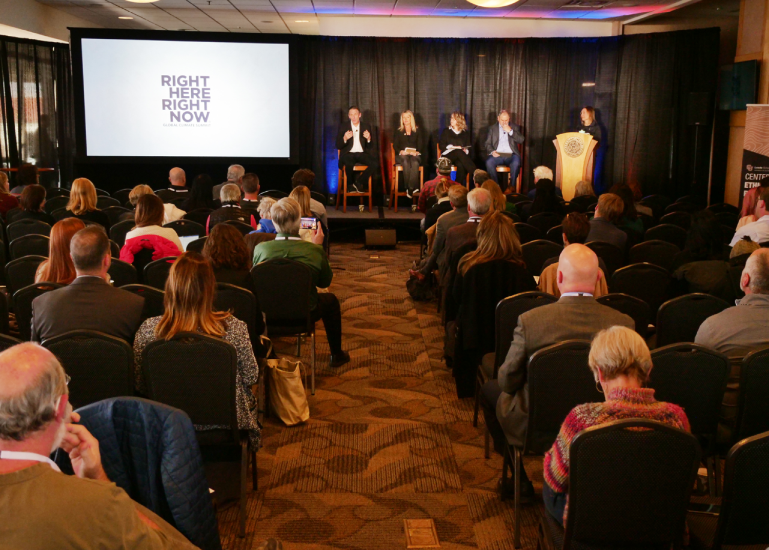 Image of attendees in conference room