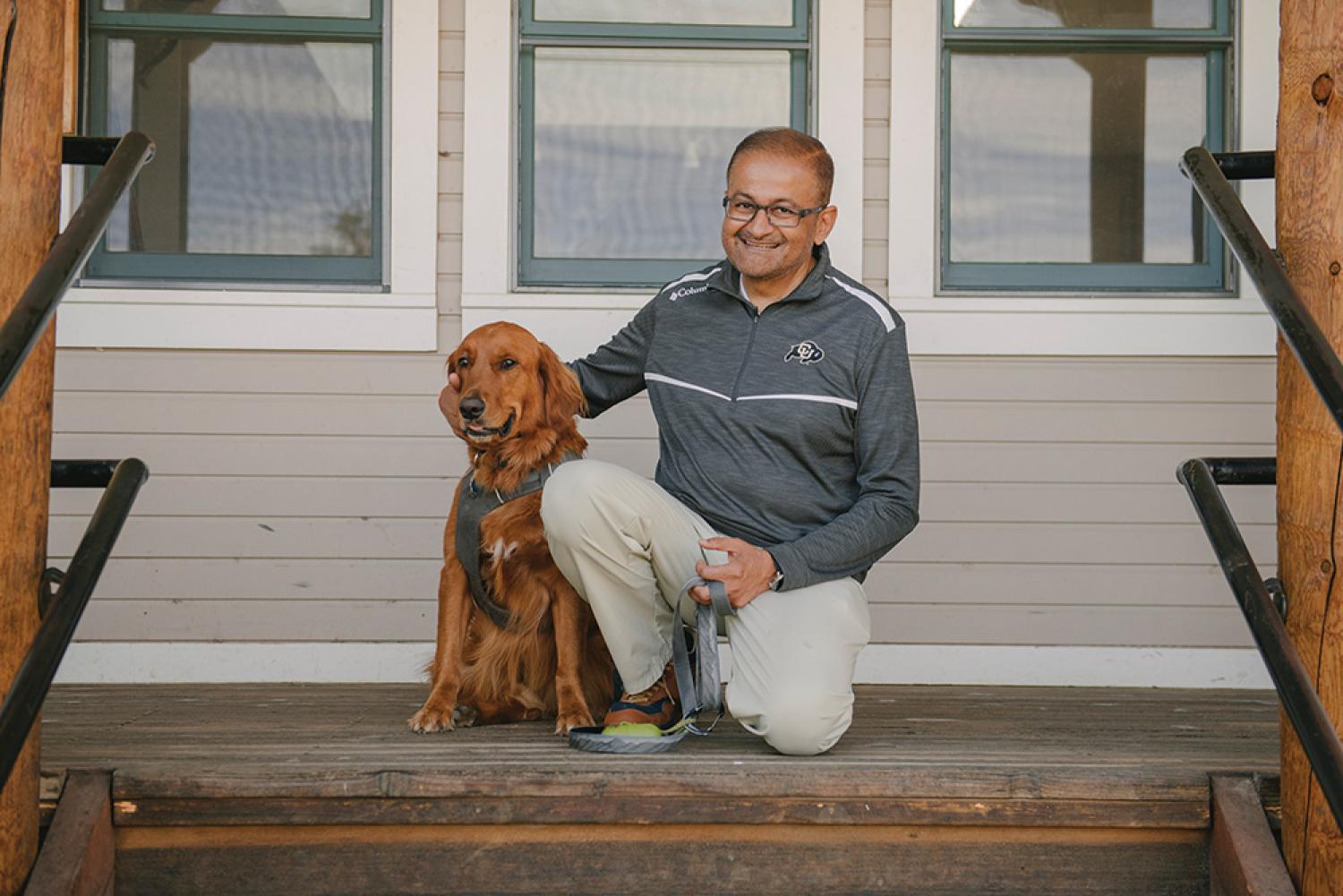Vijay Khatri poses with his dog, Max.