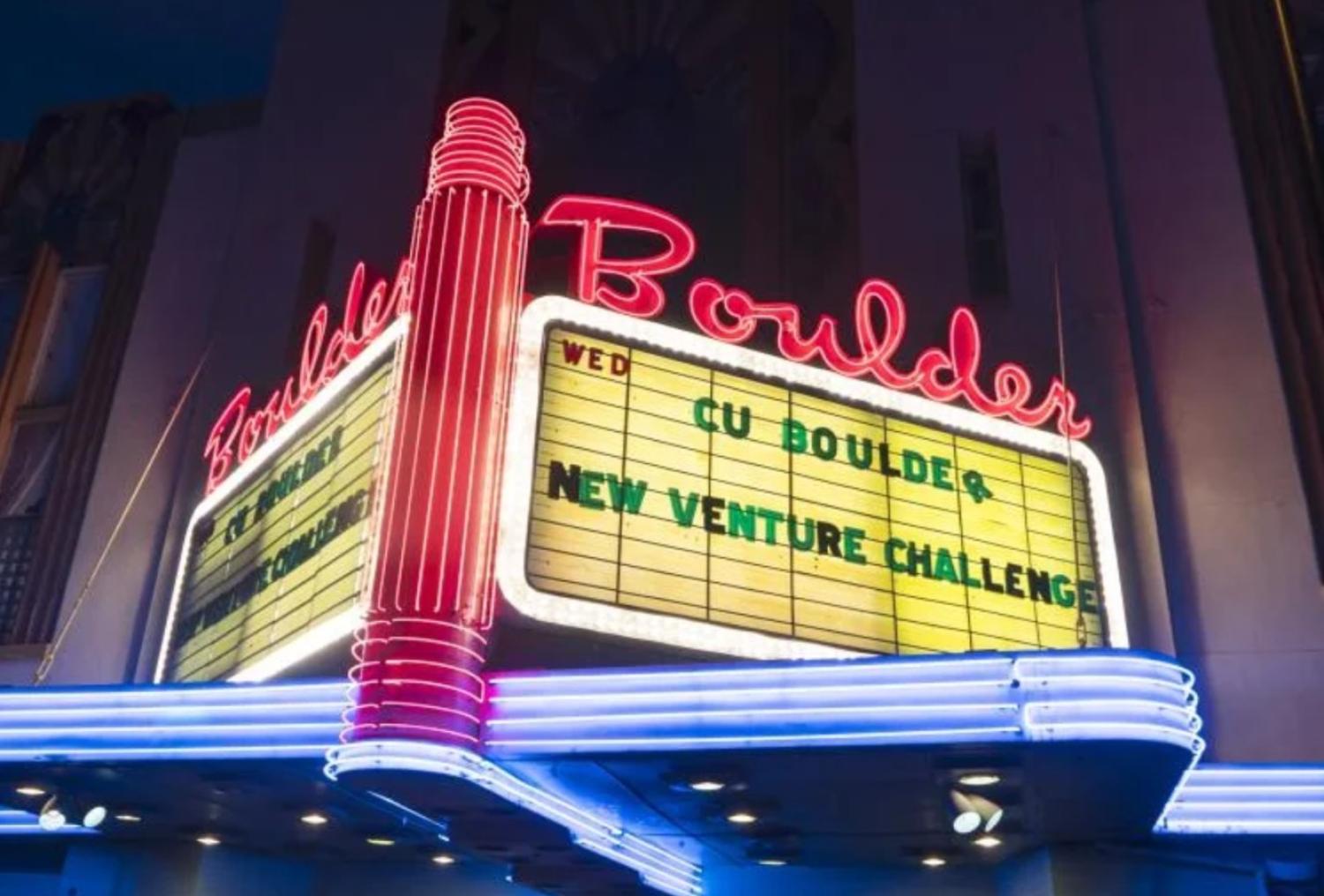 outside of the Boulder Theater with CY New Venture Challenge written on the sign
