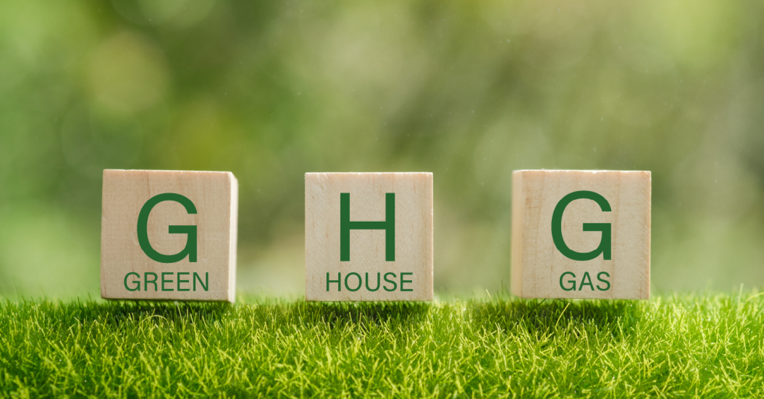 Stock image of wood blocks that spell out GHG or Greenhouse Gas Emissions