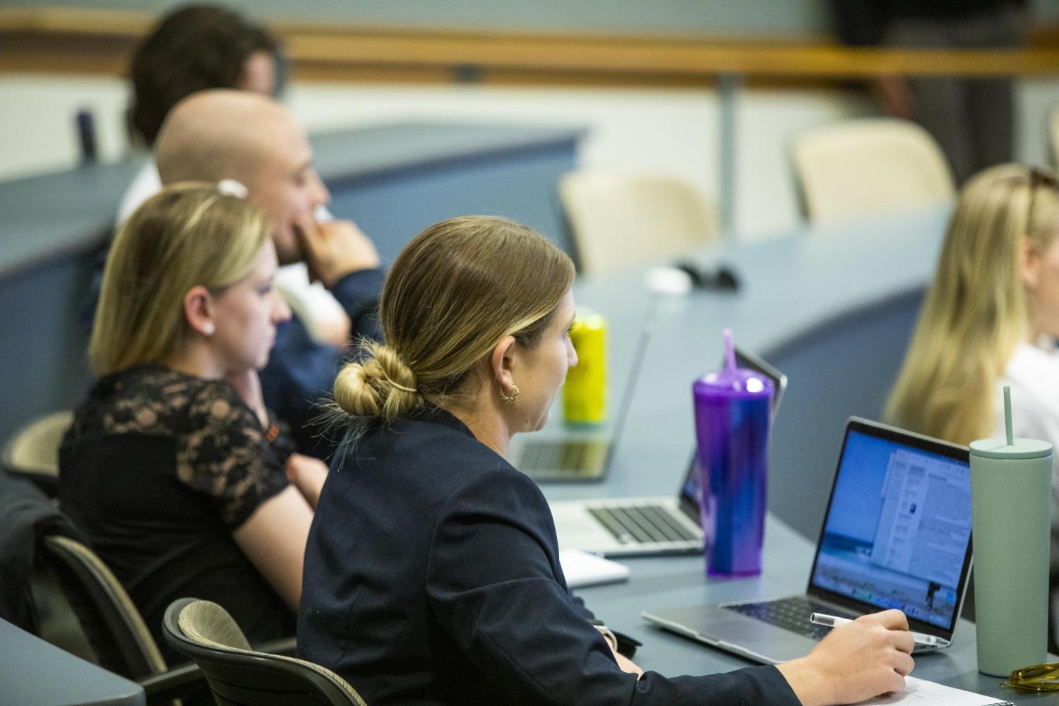 Image of woman listening to the panel