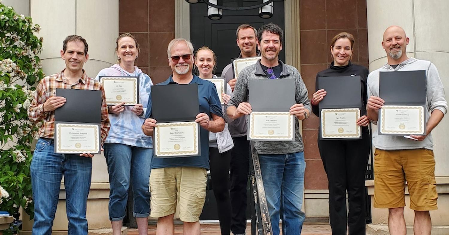 Executive Leadership attendees holding their certificates