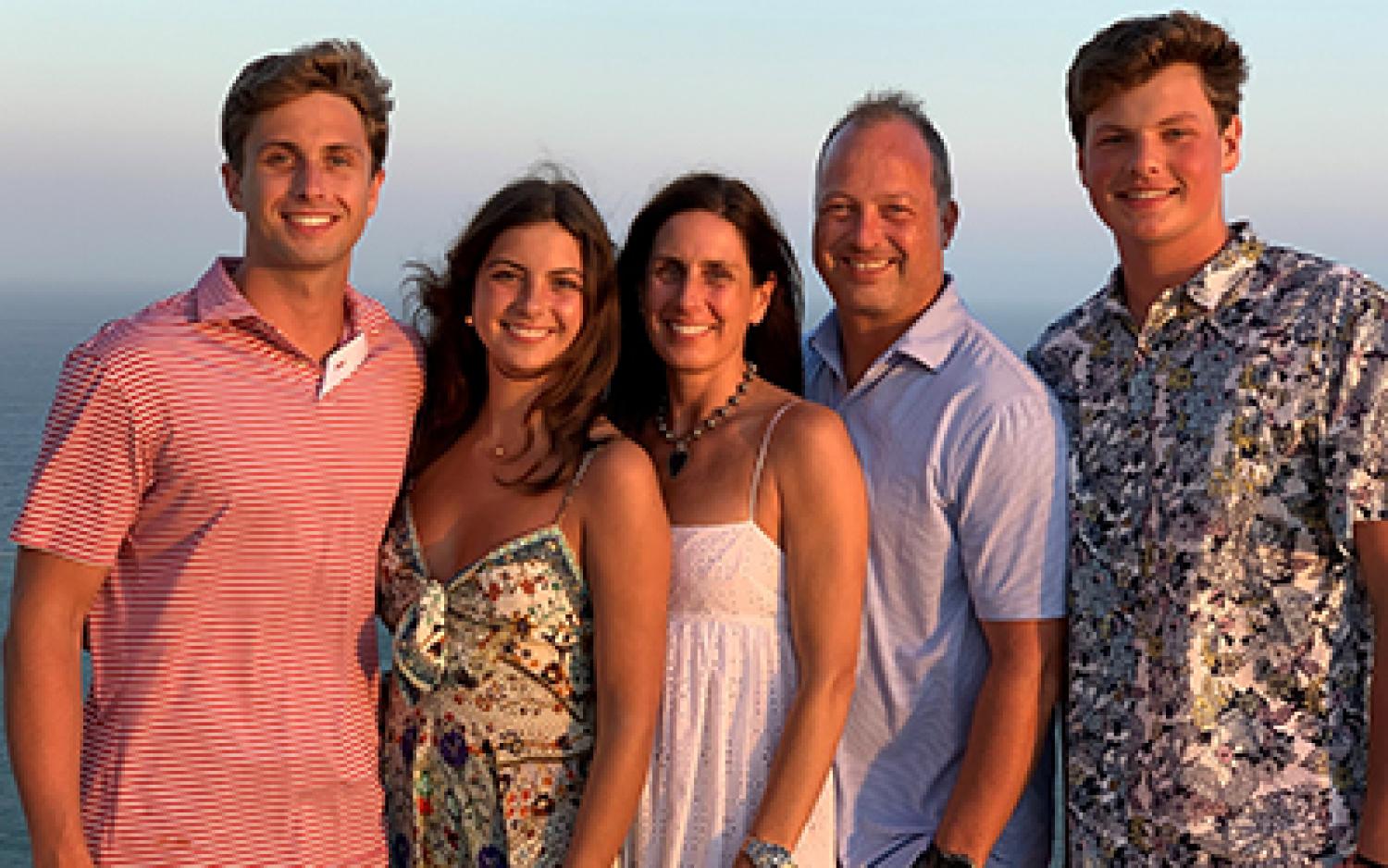 Michael Cain with his wife and children at the beach.