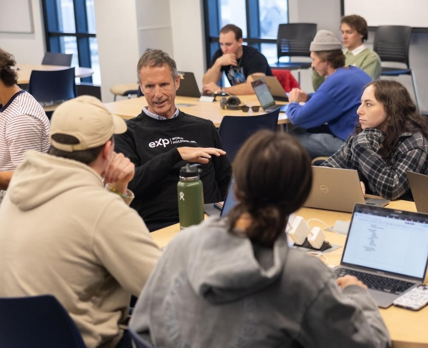 Glenn Sanford, CEO and Founder of eXp Realty, collaborated with a student team working on an assignment to write a strategic brief for eXp. [Photo credit]: AJ Canaria