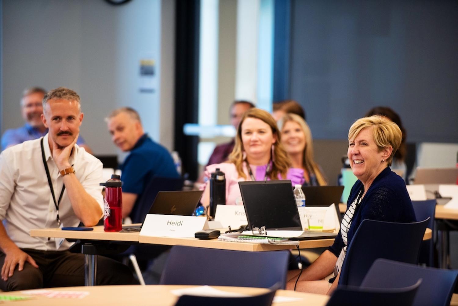Image of students of the Leeds School of business custom executive leadership program with the Graduate School of Banking