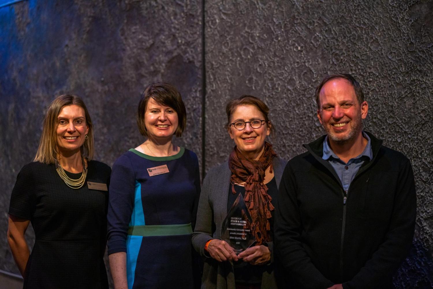 Ellen Morris posing with Community Connector Award