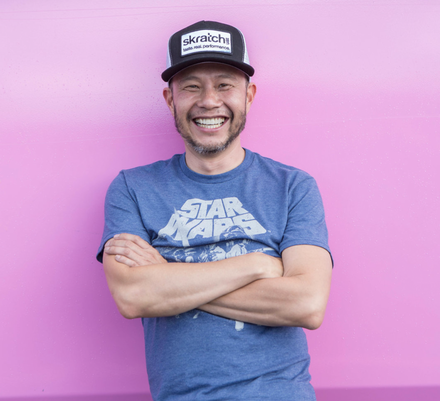 Allen Lim, Founder of Skratch Labs pictured in front of pink wall