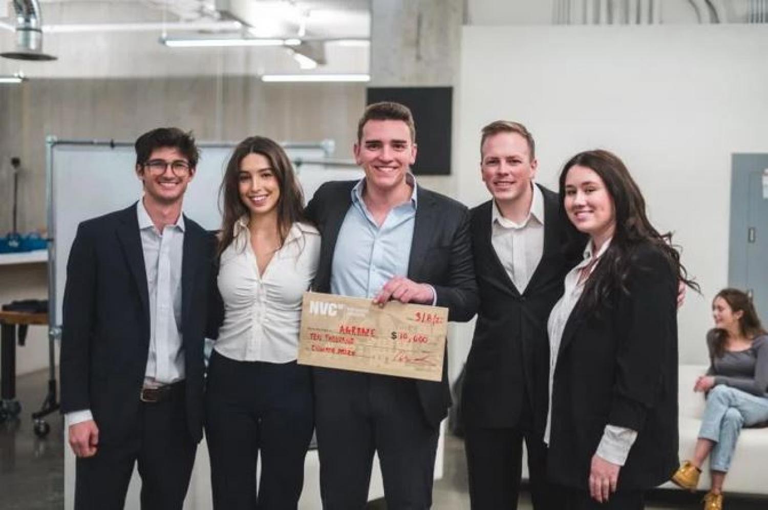 Agraaze team holding their $10,000 prize check for winning the CU's climate prize night