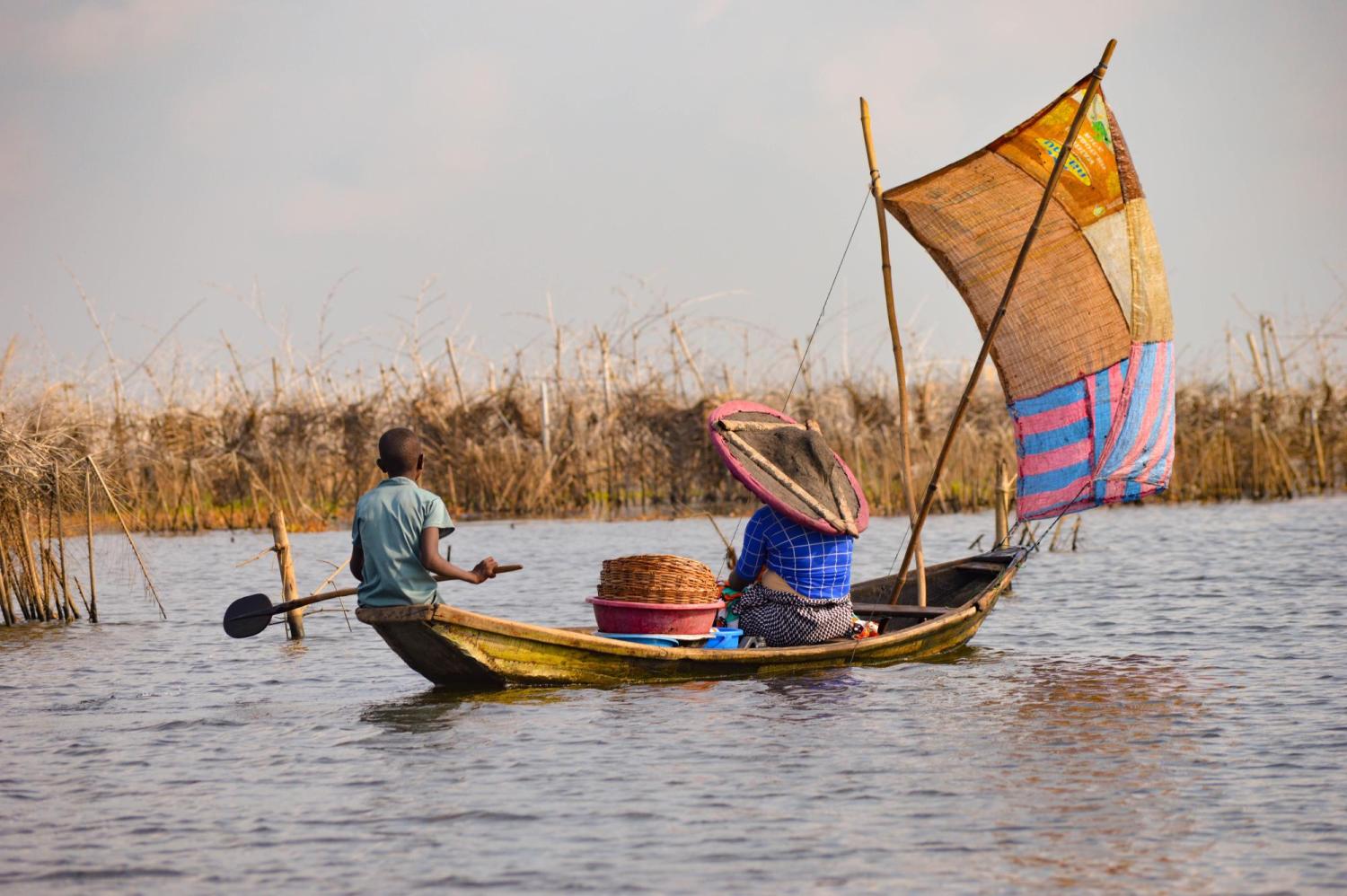 People working in a boat in Benin