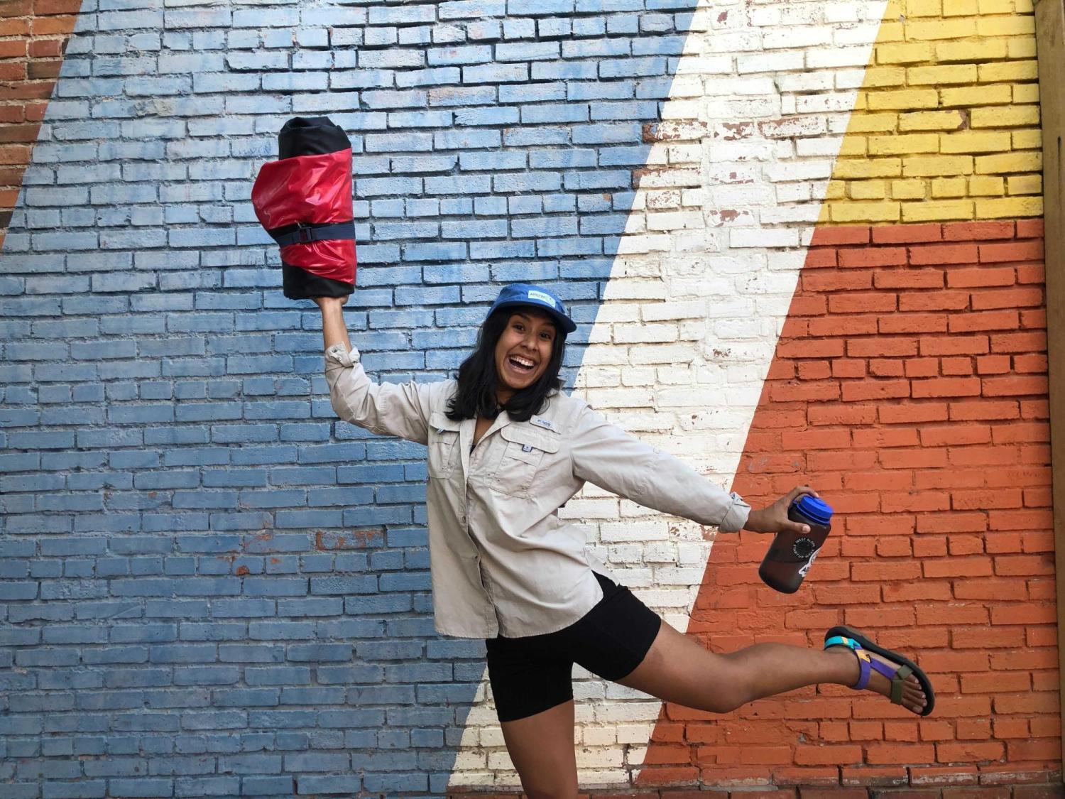 Mariana Cevallos, Founder of Alluvia Packraft, holding one of the packable boats