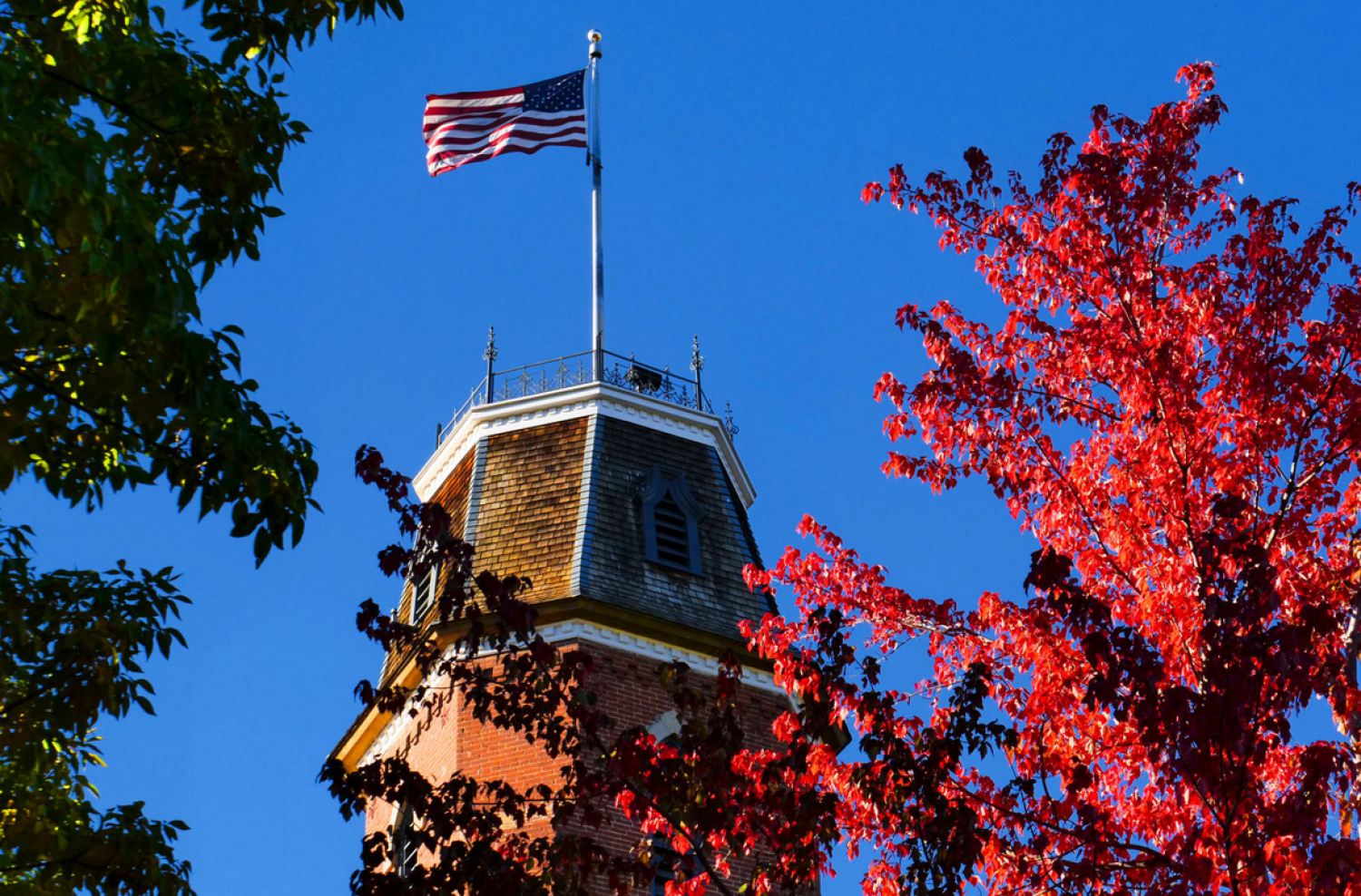 Image of CU Boulder Campus with American Flag for Veteran's Day