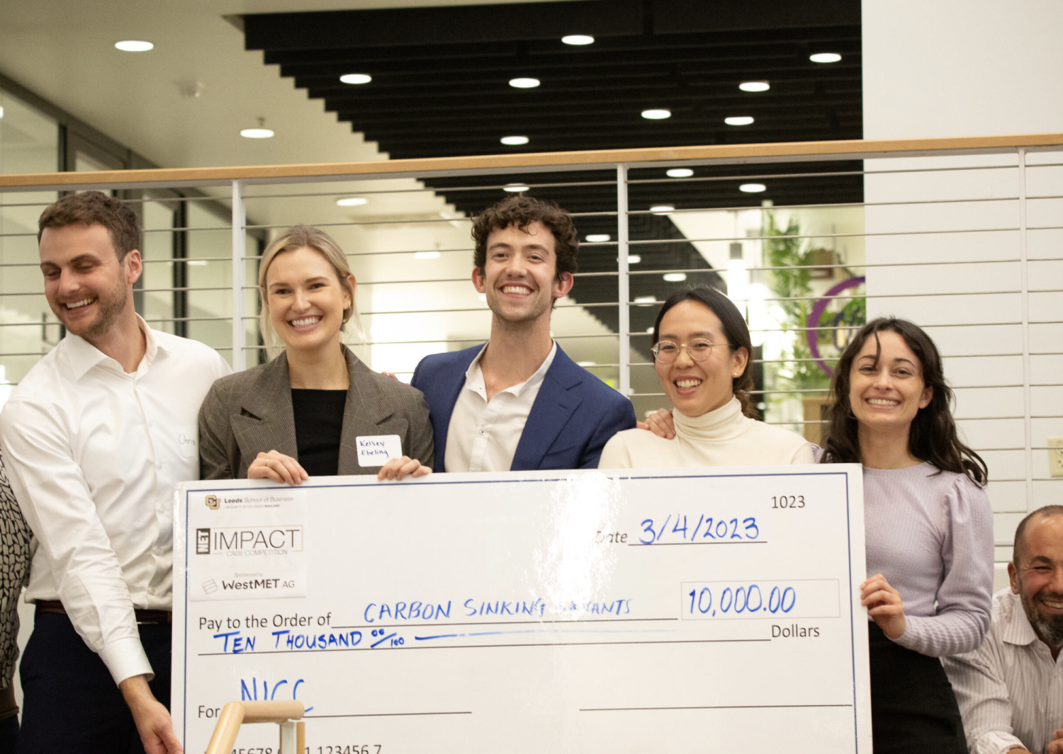 NICC Winners Holding Check