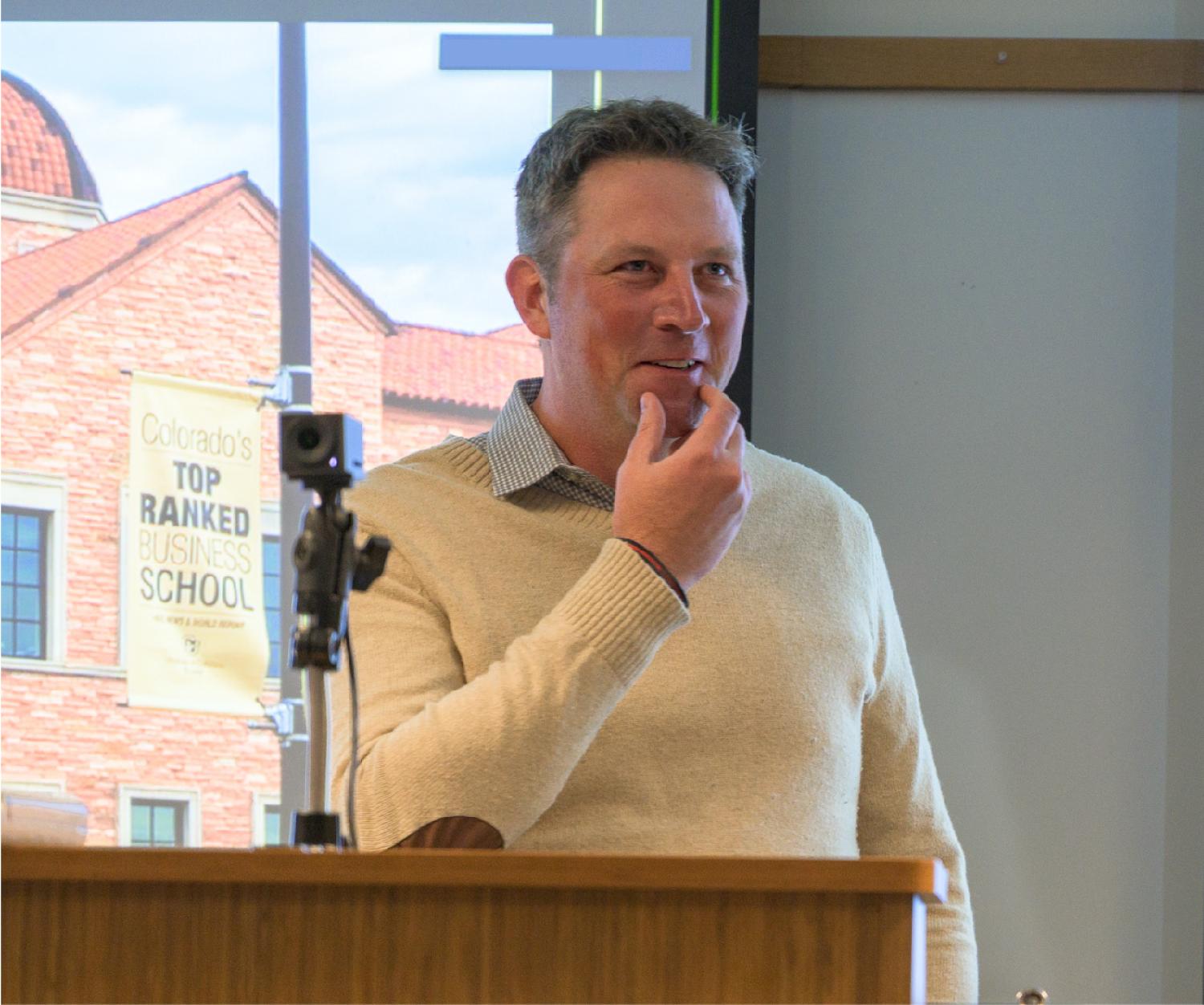 Shaun Davies speaks from a lectern