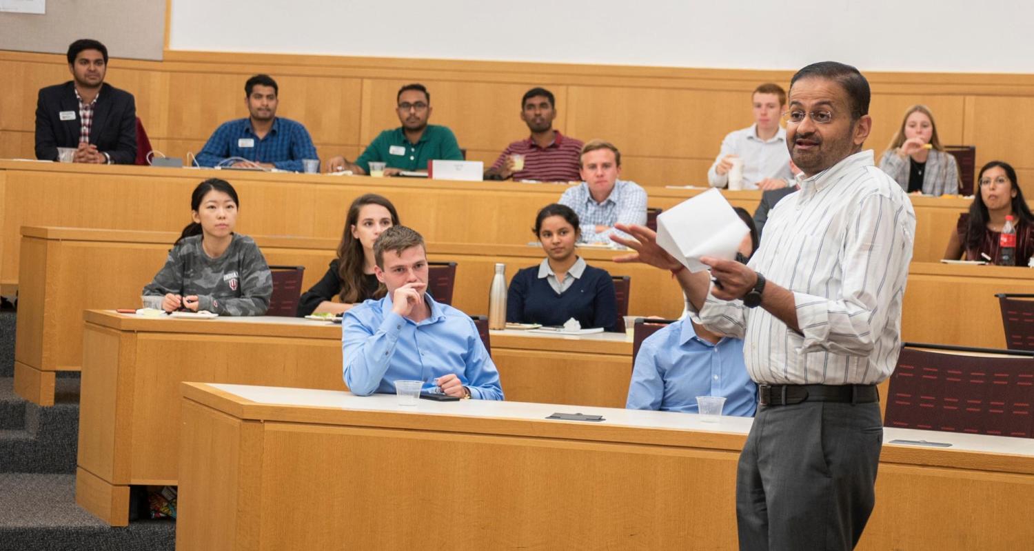 Vijay Khatri talks to a classroom of students.