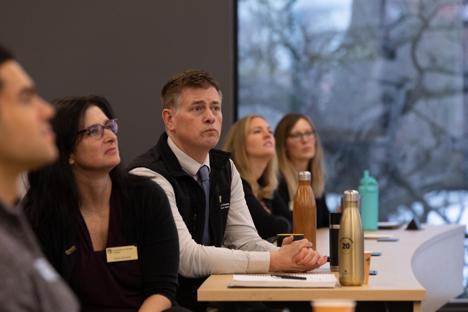 group of professionals listening to a lecture
