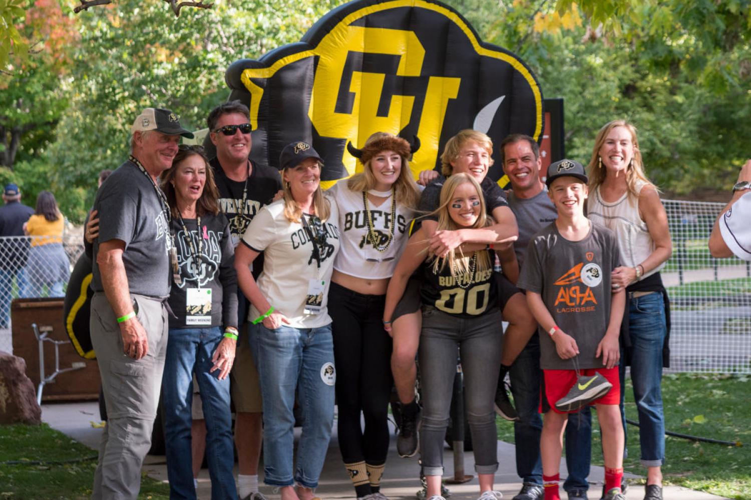 family posing at family weekend event