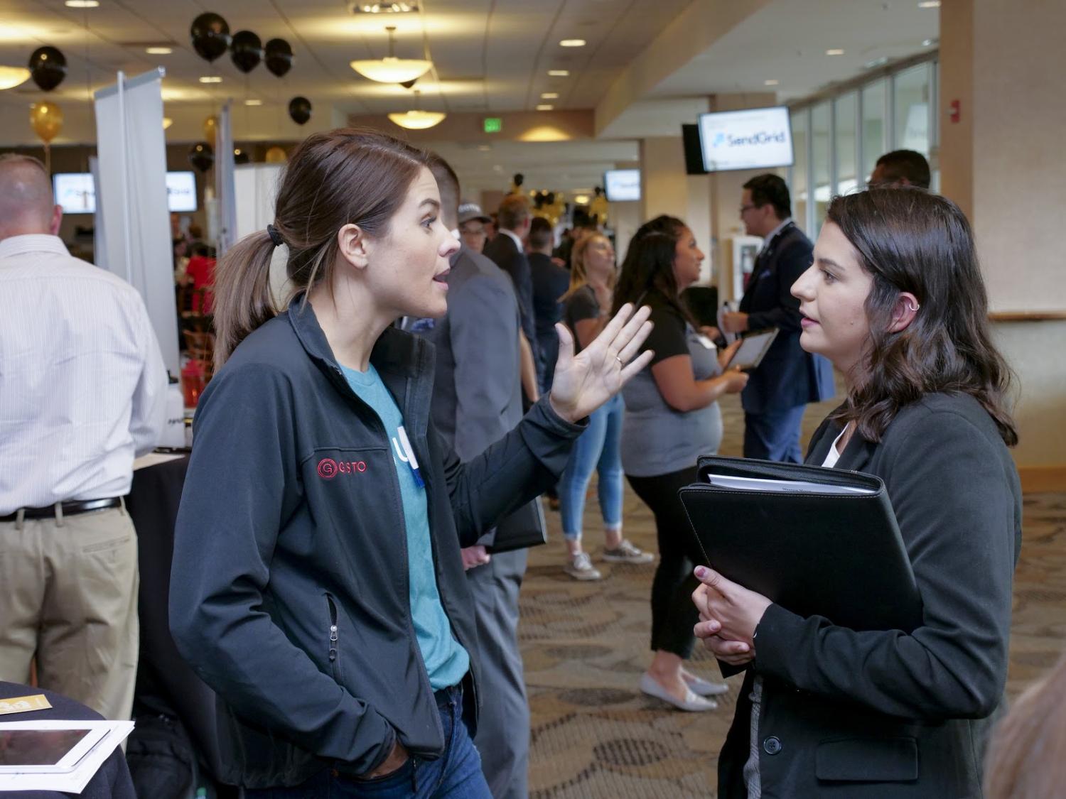 corporate partners and Leeds students engaged at a recruitment event