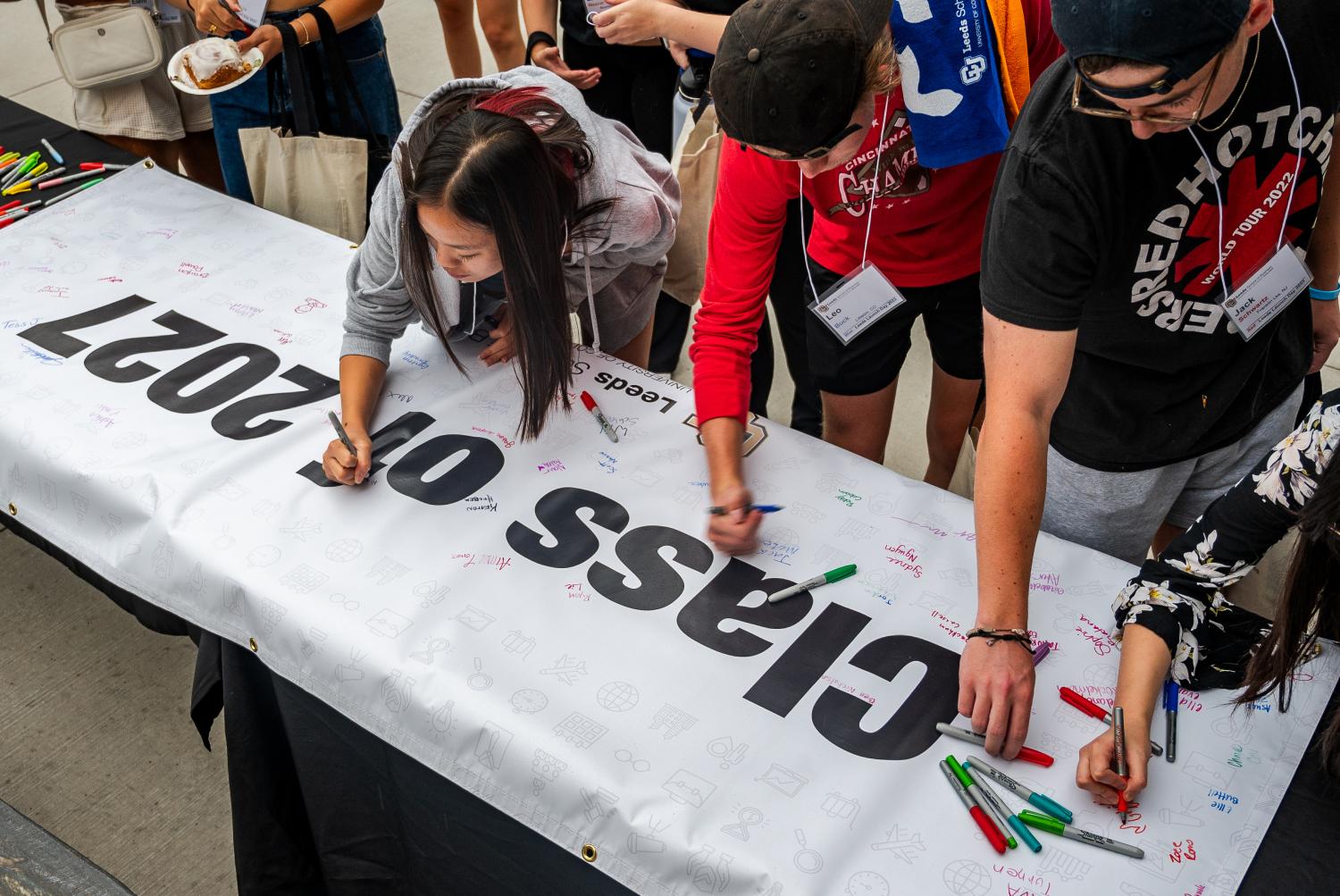 Students sign the Class of 2027 banner during Leeds Launch Day