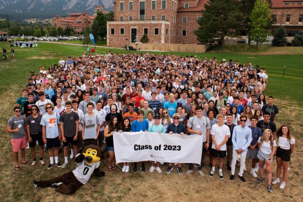 The Class of 2023 poses with their class banner during Leeds Launch Day before their freshman year. 