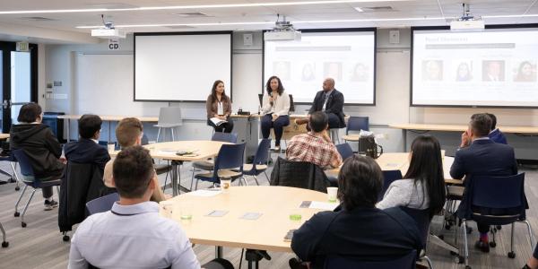 Speakers addressing an audience of prospective students