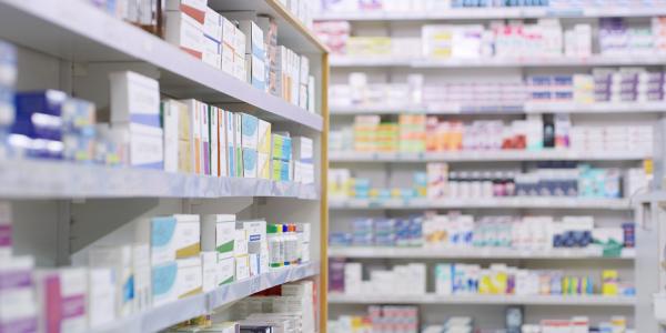 Store shelves full of different products in boxes.