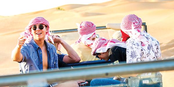 FGX student in jeep driving over sand