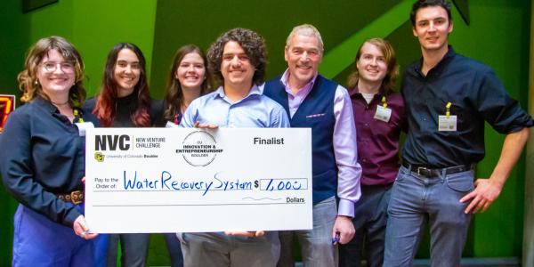 Students winning cash prize by competiting in New Venture Challenge Climate Night 2023