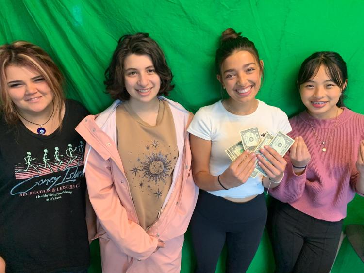 Miralisa, Emily, Skye, and Aralynn holding $5 before winning the Peak-to-Peak $5 Challenge