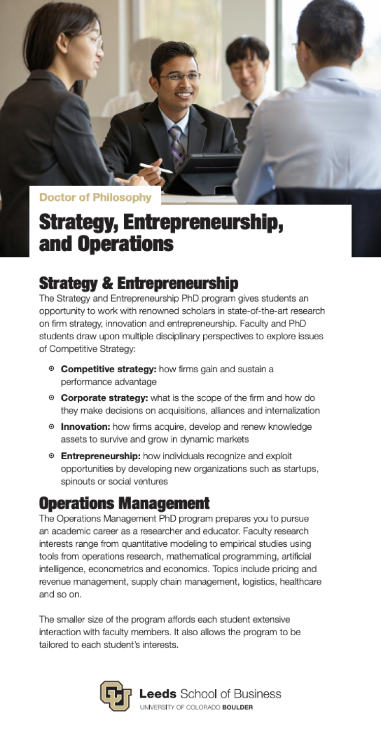 Grad students wearing professional attire collaborate on the cover of the Strategy, Entrepreneurship and Operations PhD program brochure.