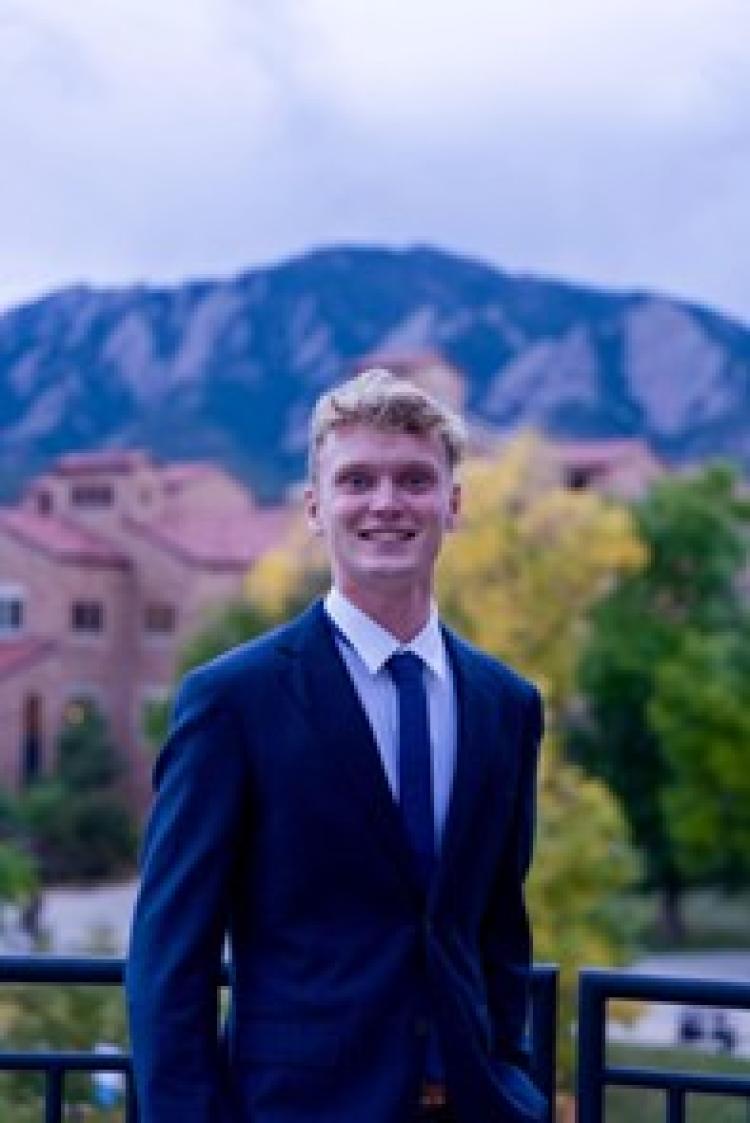 SRE student Wes Obmascik with the Flatirons in the background