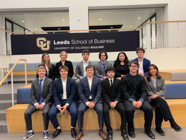 Group of people in front of Leeds Sign