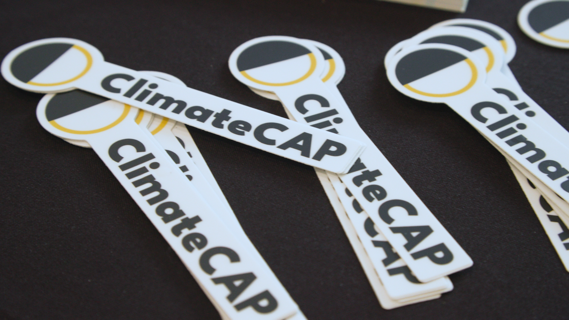 Image of ClimateCAP stickers on a table