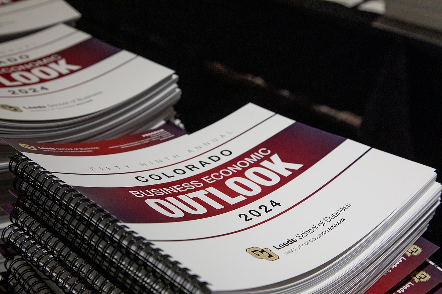 A stack of the Business Economic Outlook Forum booklets from 2023.