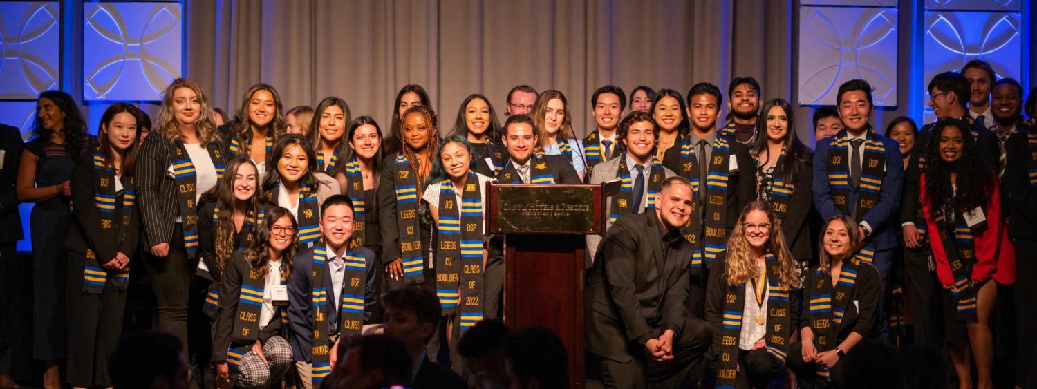 2022 Diverse Scholar Graduates on stage at academic awards banquet 