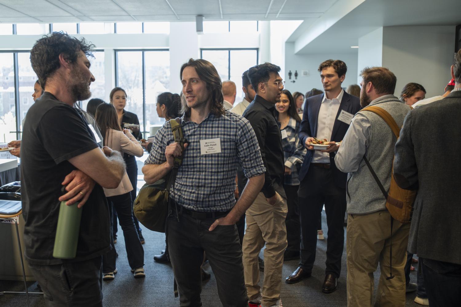 Attendees at an event mingle