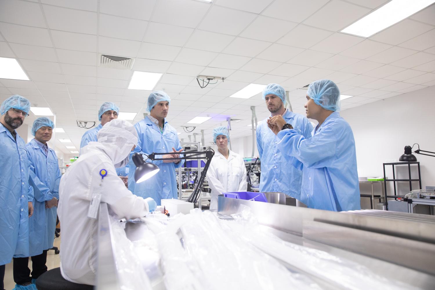 EMBA students in Ho Chi Minh City listen to a presentation at a medical tech company.