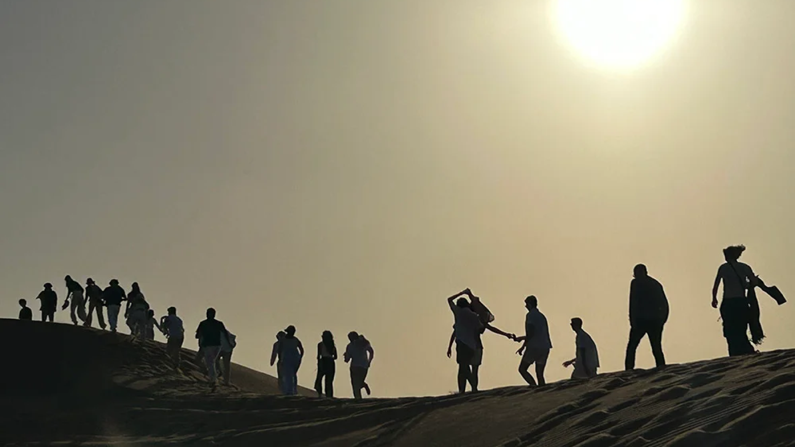 Photo shows students on a FGX trip walking through a desert