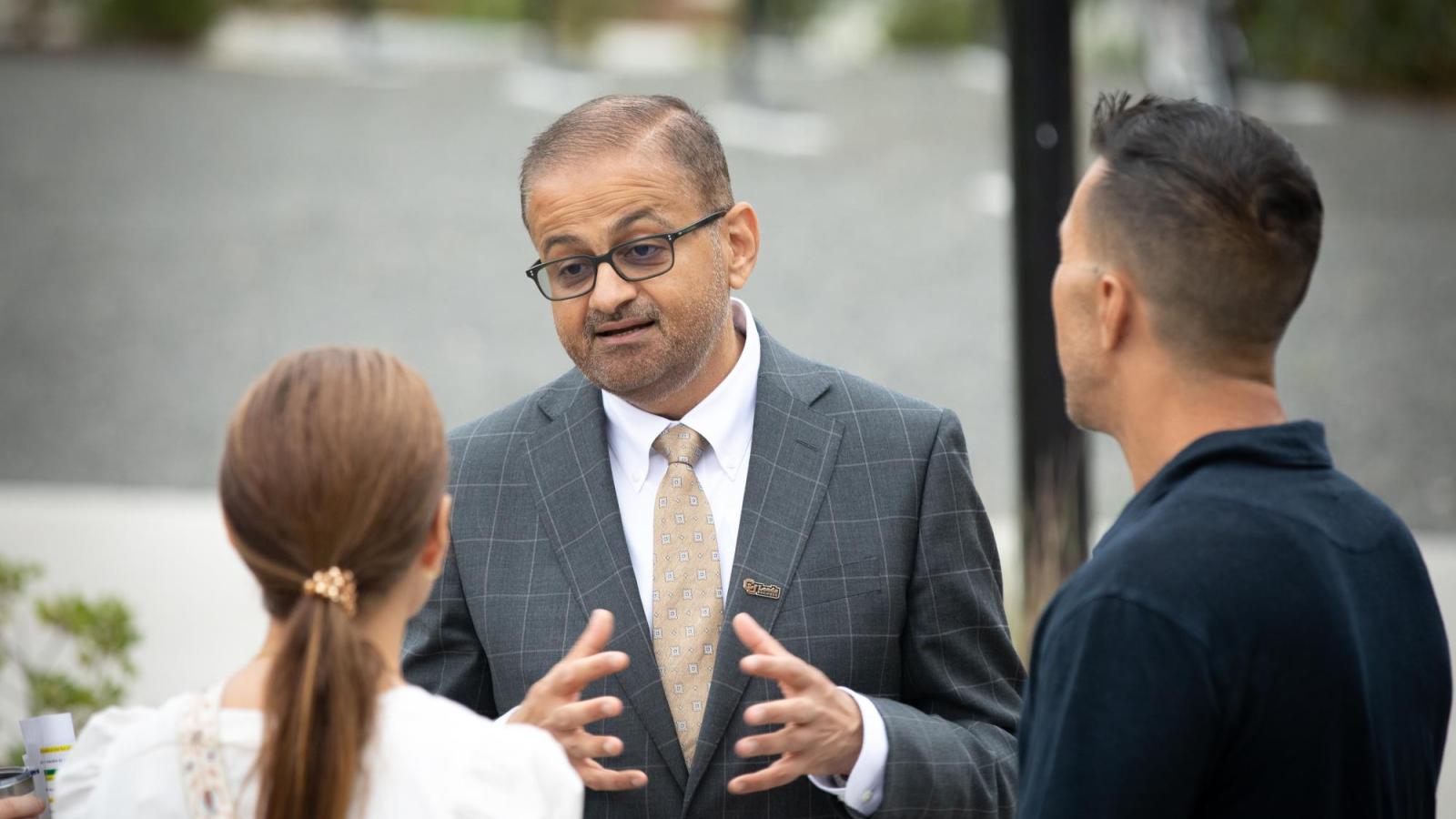 Dean Khatri speaks with parents during Leeds Launch Day