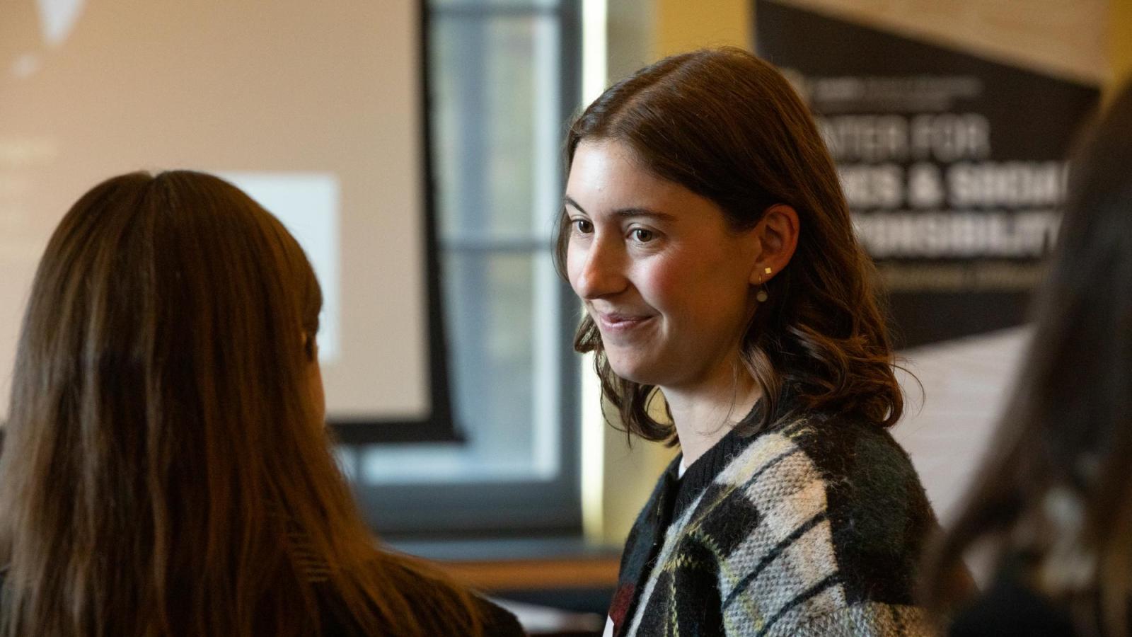 A student smiles during CESR's ESG Bootcamp