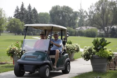 Two Golfers in a Cart