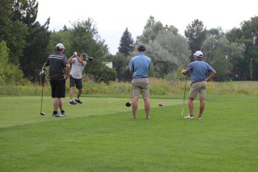 Four Golfers Teeing Off