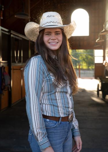 Lilly Justice poses in a stable