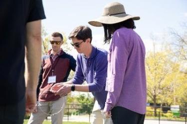 Professionals of our certificate program going through a teambuilding activity