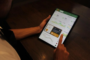 Close up of a person using an iPad