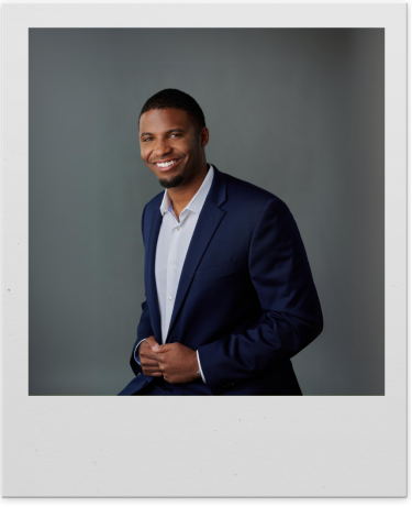 Headshot of Trace Grain in a polaroid-style frame