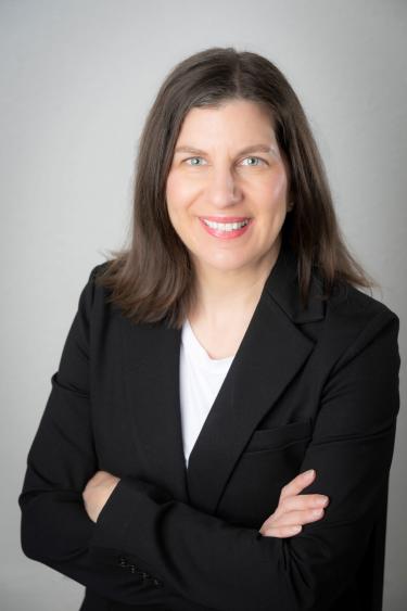 Headshot of Sarah Mudd, Sustainability and Social Impact Alum