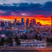 The sun rises over Denver.