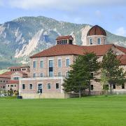 The Joelbel Building on the CU Boulder campus, with the Flatirons in the background.