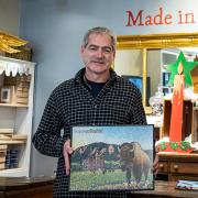 Chris Wirth in his store with puzzles.