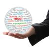 Hand holding trust ball image